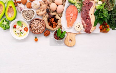Photo for Ketogenic low carbs diet concept. Ingredients for healthy foods selection set up on white wooden background. - Royalty Free Image