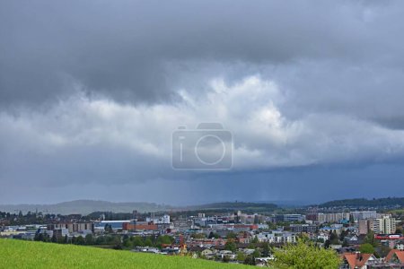 landscape from above the city of winterthur switzerland under stormy gray clouds