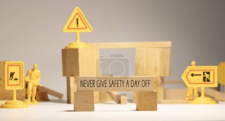 Photo for Never give safety a day off. Written on wooden surface - Royalty Free Image