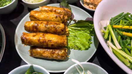 Vietnamese fried spring rolls, known as Nem Ran, are a traditional and popular dish in Vietnam. These crispy rolls are a beloved staple of Vietnamese cuisine.