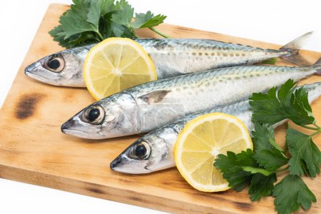 Photo for Raw mackerel fish on cutting board isolated on white background - Royalty Free Image