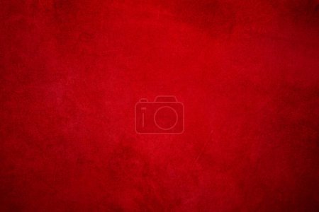 Photo for Suede background with small scratches, light red in the center and dark around the edges - Royalty Free Image