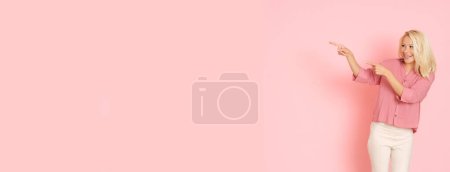 Photo for Beautiful Ukrainian woman in pink shirt on pink background. - Royalty Free Image