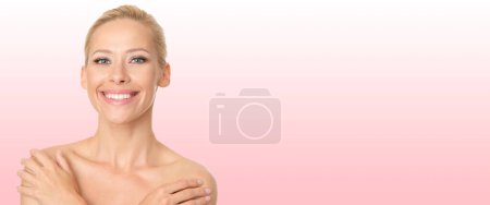 Photo for Beautiful blonde with perfect skin on pink background. - Royalty Free Image
