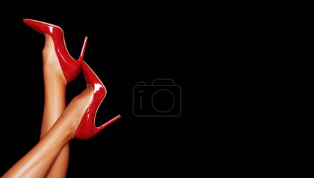 Photo for Red high heels on sexy legs. - Royalty Free Image
