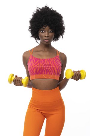 Téléchargez les photos : Beauty fitness trainer with afro hair on isolated white background. - en image libre de droit