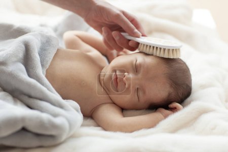 Photo for Cute newborn baby during care procedures. - Royalty Free Image
