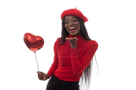 Photo for Beautiful black woman with balloon heart on isolated white background. - Royalty Free Image