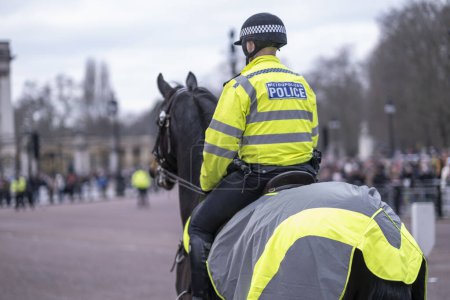Photo for London, UK. 14 January 2024. Police patrol on horse near Buckingham Palace. - Royalty Free Image