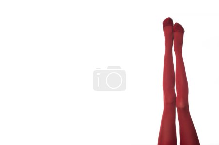 Foto de Mallas rojas y tacones altos sobre fondo blanco aislado. - Imagen libre de derechos