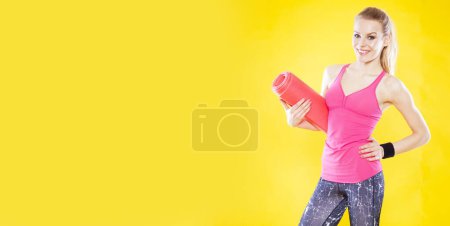 Photo for Positive fitness trainer on isolated yellow background. - Royalty Free Image