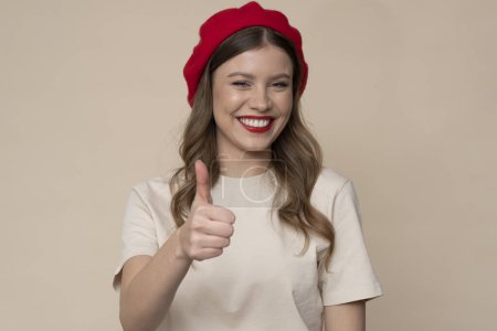 Photo for Beautiful young woman with red beret. - Royalty Free Image