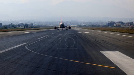 Photo for Airline is ready to fly on the runway with cityscape background, tribhuvan international airport, kathmandu - Royalty Free Image