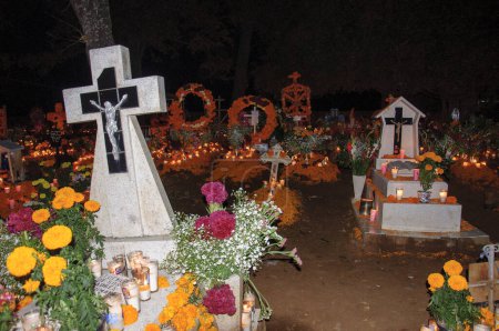 Photo for Tzintzuntzan, Michoacan, Mexico; November 1, 2023: Celebration of Day of the Dead with decoration of the cemetery and a candlelight vigil. One of the most important celebration in Mexico and the Lake Patzcuaro - Royalty Free Image