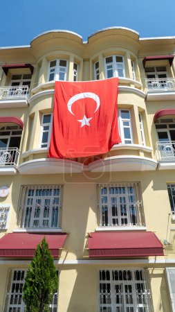 Turkish flag hanging on a building