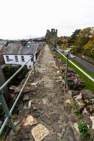 Photo for CONWY, WALES  NOVEMBER  2021 Conwy Town Walls, top of wall looking towards one of the towers. Part of the UNESCO World Heritage Site, Wales, UK, portrait, wide angle - Royalty Free Image
