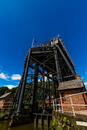 Photo for ANDERTON, ENGLAND  JUN 11  2022 View of the Anderton Boat Lift, vertically linking the River Weaver and the Trent and Mersey Canal, wide angle, portrait, copyspace at top - Royalty Free Image