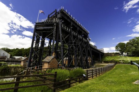 Photo for ANDERTON, ENGLAND  JUN 11  2022 View of the Anderton Boat Lift, vertically linking the River Weaver and the Trent and Mersey Canal, wide angle, landscape, angle view showing whole structure - Royalty Free Image