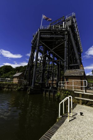 Photo for ANDERTON, ENGLAND  JUN 11  2022 View of the Anderton Boat Lift, vertically linking the River Weaver and the Trent and Mersey Canal, wide angle, portrait, close up - Royalty Free Image