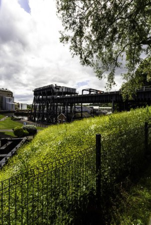 Photo for ANDERTON, ENGLAND  JUN 11  2022 View of the Anderton Boat Lift, vertically linking the River Weaver and the Trent and Mersey Canal, wide angle, portrait, rear view showing whole structure - Royalty Free Image