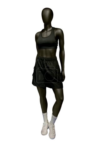 Full length image of a female display mannequin wearing sportswear isolated on a white background