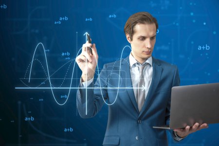 Attractive young european businessman with laptop using abstract glowing mathematical formula graph on blue background. Equation, digital data and mathematics app concept