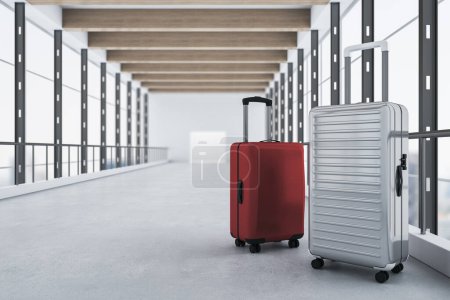 Red and gray suitcases placed in contemporary blurry airport interior with panoramic windows and city view. Travel and luggage concept. 3D Rendering