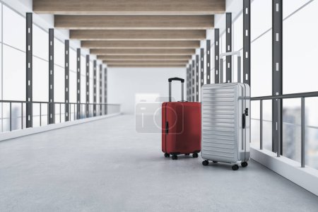Red and gray suitcases placed in modern blurry airport interior with panoramic windows and city view. Travel and luggage concept. 3D Rendering