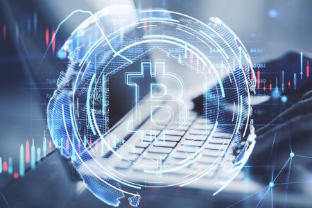 Close up of businessman hands using laptop with glowing bitcoin hologram on blurry background. Cryptocurrency and crypto market concept. Double exposure