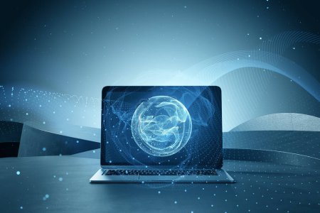 Close up of laptop computer on desktop with polygonal globe hologram on blurry background. World map with global social network. Future concept. Blue futuristic background with planet. Double exposure