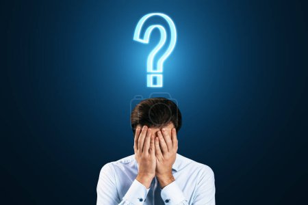 Photo for Isolated facepalm man with question sign over his head, doubt and decision concept on dark blue background - Royalty Free Image