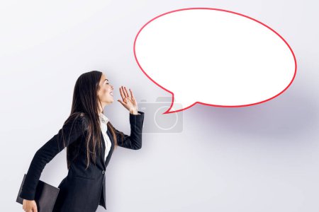 Photo for Attractive young european businesswoman with speech bubble on white background. Opinion, speech and communication concept. Mock up place - Royalty Free Image