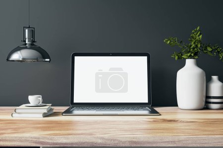 Photo for Front view on blank whit modern laptop screen with space for your web design on wooden work table with vases and books on dark grey wall background with chrome lamp. 3D rendering, mock up - Royalty Free Image