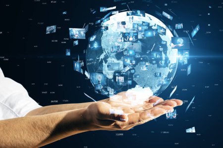 Close up of businessman hands holding creative globe with telecommunication picture icons. Business, video conference, remote group work