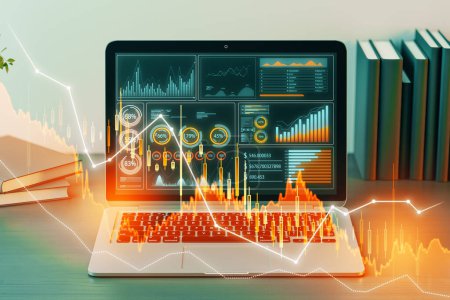 Close up of laptop at table with downward candlestick forex chart on blurry backdrop. Trade, finance and technology concept. Double exposure