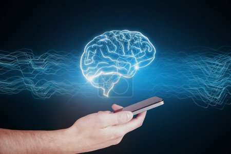 Close up of businessman hand holding cellphone with creative digital brain hologram on blue background. Hi-tech innovation and AI concept