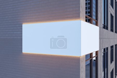 Cartel blanco iluminado con el lugar de la maqueta para la publicidad en el exterior moderno del edificio. Renderizado 3D