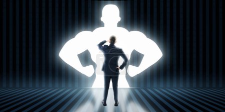 Back view of businessman with very strong illuminated shadow flexing muscles on dark wall background. Personal development, inner strength, motivation concept