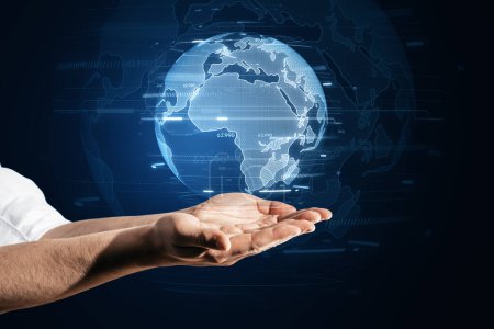 An outstretched hand holds a transparent hologram of the earth, signifying global reach and international cooperation in a connected world