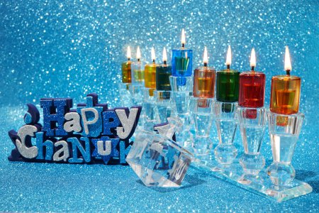 Jewish holiday Hanukkah background with menorah and dreidel with letters Gimel and Nun-stock-photo