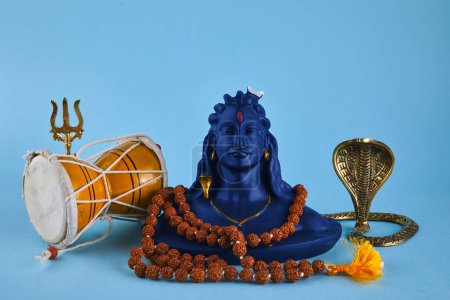 Foto de Shivaratri background with Shivas trident, Pellet Drum Damroo musical instrument ans snake . Hindu festival Maha Shivratri. - Imagen libre de derechos