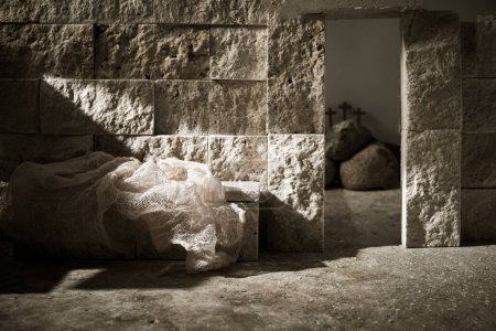 Photo for Empty tomb while light shines from the outside. Jesus Christ Resurrection. Christian Easter concept - Royalty Free Image