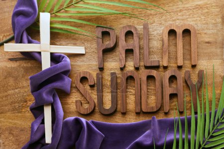 Palm sunday background. Cross and palm on vintage background