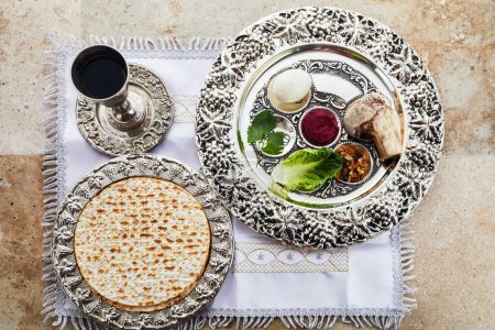 Photo for Composition with symbolic Passover, Pesach, items and meal on stone background - Royalty Free Image