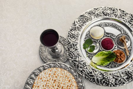 Photo for Composition with symbolic Passover, Pesach, items and meal on vintage background - Royalty Free Image