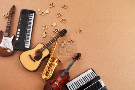 Photo for Happy world music day. Musical instruments on brown background - Royalty Free Image