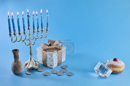 Photo for Jewish holiday Hanukkah with menorah, traditional Candelabra, donut and dreidel, spinning top - Royalty Free Image