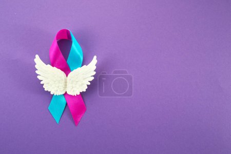 Photo for World Prematurity Day with Pink and Blue Ribbon and angel wings. - Royalty Free Image