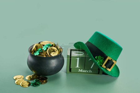 Photo for Happy St. Patricks Day background with a leprechaun green hat full of gold coins. - Royalty Free Image