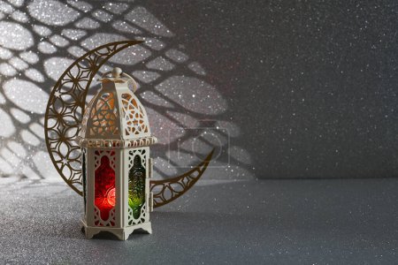 Ramadan Kareem. golden moon and lantern on glowing background for Holy month Ramadan celebration.